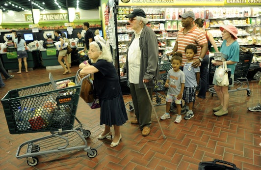 New Yorkers line up for the checkout line at the Fairway Supermarket on the Upper East Side of New York as Hurricane Irene continued toward the East Coast
